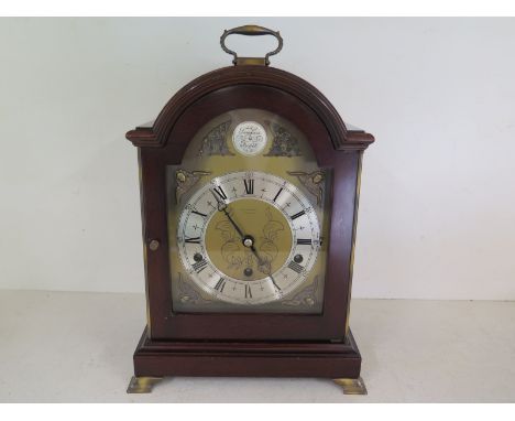 An Elliot Westminster Whittington mahogany cased bracket clock with silvered chapter ring with Roman numerals