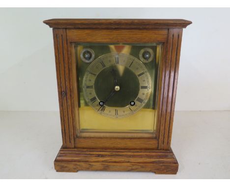 A W&H Ting Tang oak cased four glass bracket clock, with golden coloured dial and Roman numerals