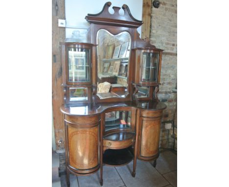 A good quality Edwardian mahogany and inlaid side cabinet with a swan neck pediment above a central shaped mirror flanked eit