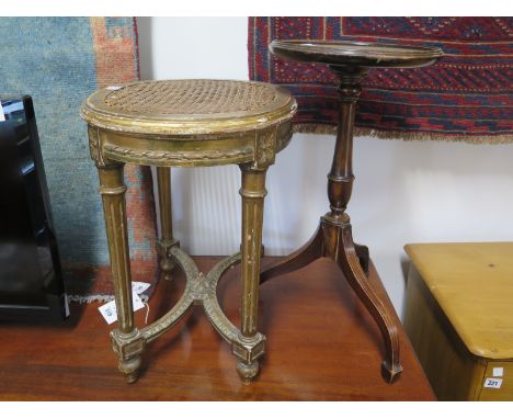 A Victorian gilt stool with a cane seat - Height 51cm x 50cm x 36cm and a mahogany tripod wine table - Height 59cm x Diameter