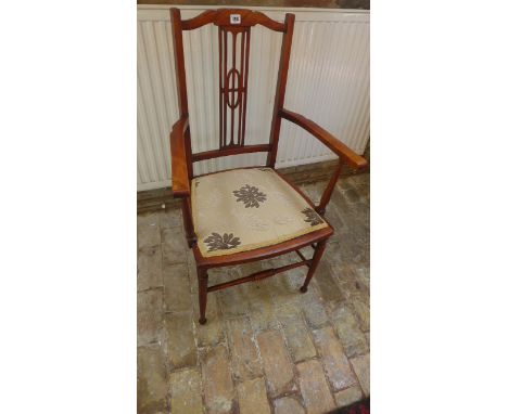 A beech armchair with recently upholstered floral seat