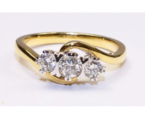 Three stone diamond cross-over ring hallmarked 18ct (diamonds approx 0.5 carat)   Condition Report  Size "M" Click here for f