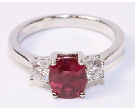 Oval ruby and round brilliant cut diamond three stone white gold ring hallmarked 18ct, ruby approx 2 carat   Condition Report