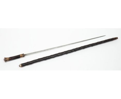 A silver mounted sword stick:, of naturalistic form with straight single edged fullered blade and reeded decorated pommel, bl