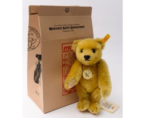 Steiff - A classic blonde plush reproduction 1909 style bear:, stitched snout, glass eyes and felt pads, the buttoned ear tag