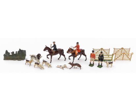A Britains hunting group:, comprising two riders on horseback, two standing huntsmen, four hounds and a fox, also together wi