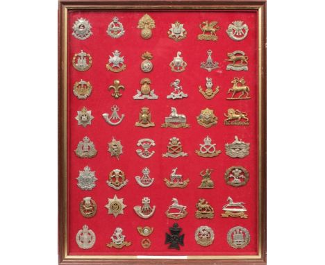 A collection of mostly modern Army badges: mounted and framed.