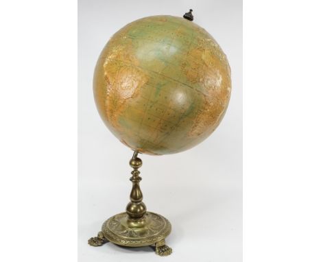 A Philips' 19-inch terrestrial globe on brass stand:, the globe with raised geography and shipping and railway line routes, s