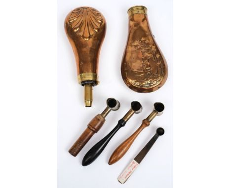 Two copper powder flasks:, one embossed with a hunting scene and devoid of nozzle, together with three adjustable powder meas