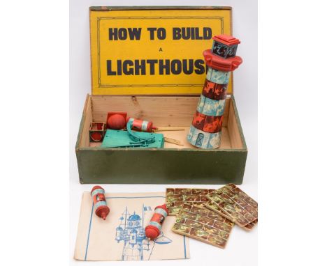 An early 20th century 'How to build a lighthouse' set:, comprising stained pine blocks with lithograph printed covers and ins