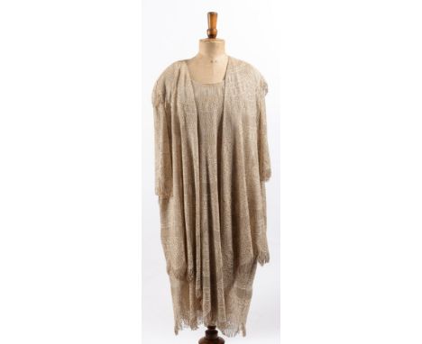 An early 20th century  white crochet and gilt thread cocktail dress and jacket displayed on a period mannequin:.