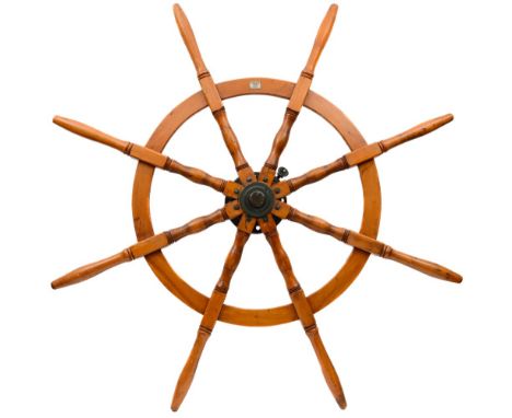 A Dutch style cargo helm by Hunt and Sons, Liverpool:, the cast iron boss with locking hub radiating turned spindles with iro