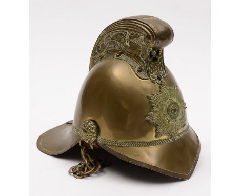 An Edwardian brass Merryweather pattern fireman's helmet:, the comb with embossed dragon and the front mounted with National 