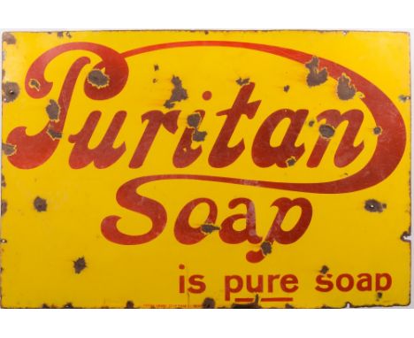 A 'Puritan Soap is Pure Soap' enamel advertising sign:, red lettering on yellow background, 61cm x 92cm.
