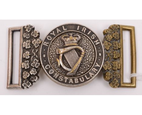 A Royal Irish Constabulary two piece belt buckle:, the Victorian crown above harp on mottled background circled by 'Royal Iri