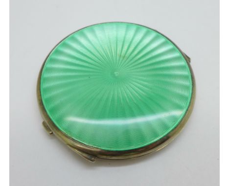 A silver and green enamel compact, Birmingham 1948, Mappin &amp; Webb, (a/f, dent on the underside) 