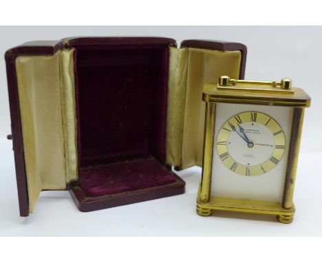 A Looping 8-day travel alarm clock, cased 