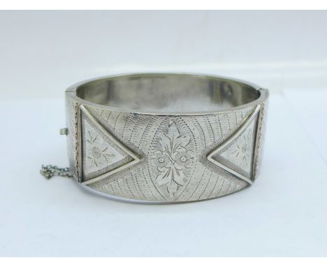 A Victorian bangle marked 'silver band', (a/f, dented) 