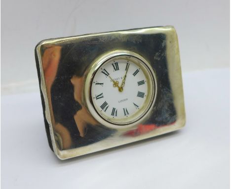 A small silver mounted desk clock, width 6.5cm 