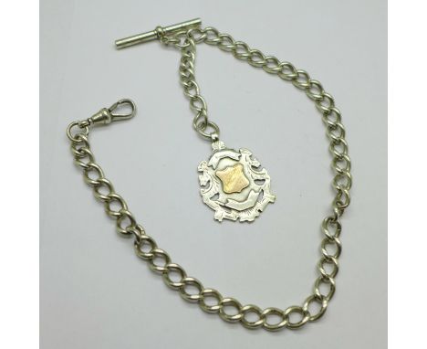 A silver Albert watch chain, each link marked, and a silver fob medal with gold applied decoration, fob inscription erased, 4