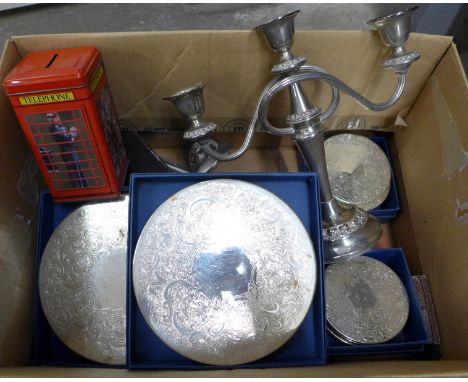 Six silver handled knives, plated table mats and coasters, candelabra, etc. **PLEASE NOTE THIS LOT IS NOT ELIGIBLE FOR POSTIN