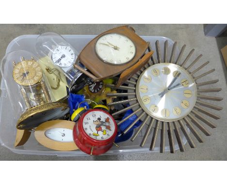 A collection of clocks including a Smiths quartz carriage clock, other carriage clocks, cuckoo, modern novelty Mickey Mouse, 