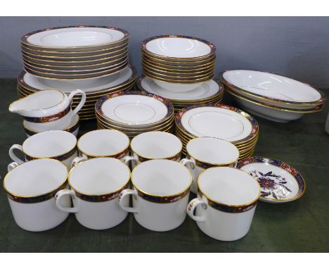 A Royal Worcester Prince Regent eight setting dinner service with cream and sugar, two oval dishes and a pin dish 