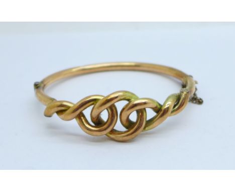 An early 20th Century 9ct gold knot design bangle, 10.1g 
