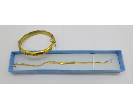 A 9ct gold bracelet, 1.1g, and a 9ct gold metal core bangle 