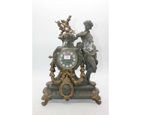 A late 19th century spelter mantel clock, surmounted by a figure of Diana the Huntress, the circular dial with raised enamel 