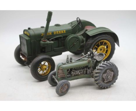 A reproduction metal model fo a John Deere tractor, 32cm; together with one other smaller (2) 