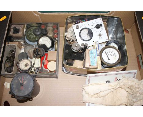 A collection of vintage measuring dials for pressure, volts and amps, together with various other mechanical parts