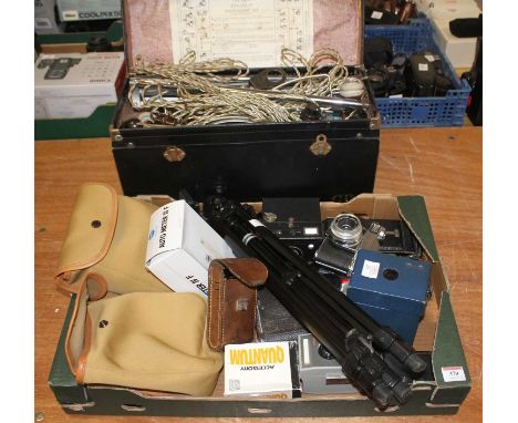 A collection of cameras and accessories, to include a Kodak Retina Reflex S SLR camera, a tripod and a vintage flash set
