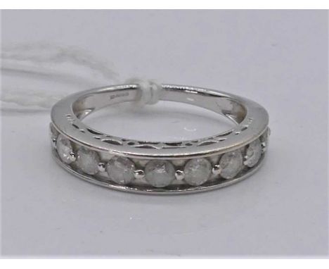 A modern 9ct white gold diamond half hoop ring, arranged as 9 brilliants, total diamond weight estimated approx 0.9ct, clarit