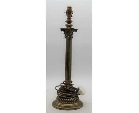 A brass table lamp having a Corinthian capital on a fluted column and domed base, height 51cm