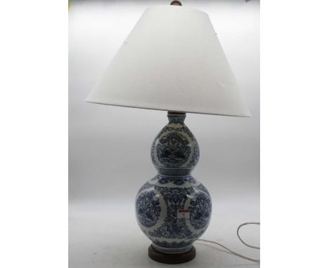 A modern Chinese style blue &amp; white table lamp of double gourd form, with silk shade, height 40cm (excluding fittings and