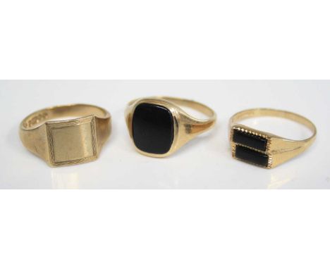 A gent's 9ct gold signet ring; together with a 9ct gold black onyx set signet ring; and a 9ct gold double onyx set dress ring