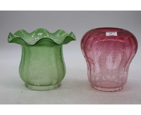 A Victorian green tinted and acid etched frilled glass oil lamp shade, height 17cm, together with one other cranberry tinted 
