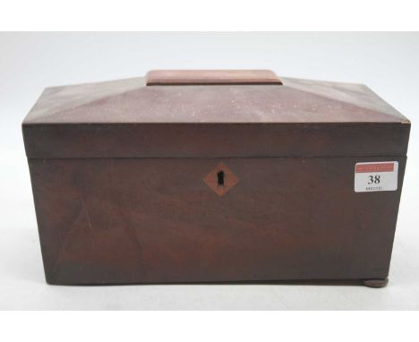 An early Victorian mahogany tea caddy of sarcophagus form on bun feet, width 27cm