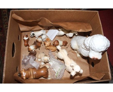 A collection of vintage pottery models of dogs