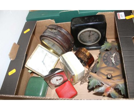 A collection of vintage clocks to include a Smiths ebonised mantel clock and a Swiss cuckoo clock