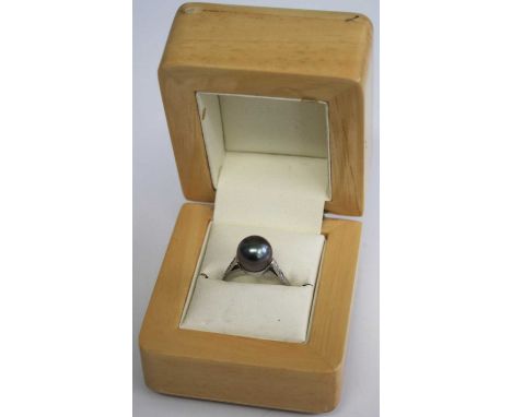 A white metal, cultured grey pearl and diamond point set dress ring, unmarked but tests as platinum, 3.6g, size K