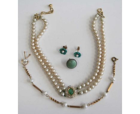 A pair of carved green jade and seed pearl set ear studs, as flower head settings and on yellow metal posts, dia.10mm; togeth