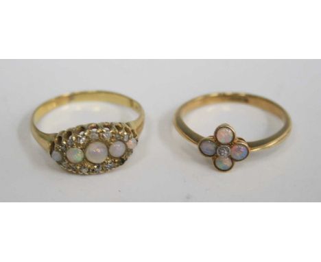 An 18ct yellow gold opal flower head cluster ring, set with a centre diamond highlight, size N; together with a yellow metal,