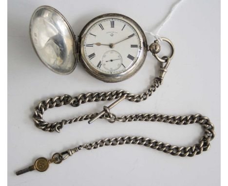 An Edwardian silver cased full hunter watch by Rotherham's, having engine turned cases (worn), signed white enamel dial and k