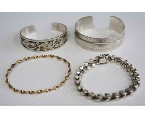 A continental silver bracelet; together with a white metal cuff bangle stamped 925; and one other, 103g; and a yellow metal s