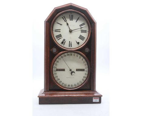 A late 19th century mahogany cased perpetual calendar clock, having twin painted dials, the upper with Roman numerals, the lo