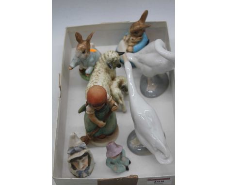 A collection of ceramic items, to include Lladro porcelain geese,Goebel and Beswick Peter Rabbit examples 