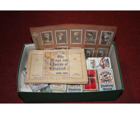 A collection of vintage cigarette cards, mainly Players and Tenner