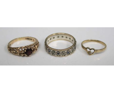 A yellow and white metal eternity ring set with small blue and white sapphires, unmarked but tests as 9ct; together with a 9c